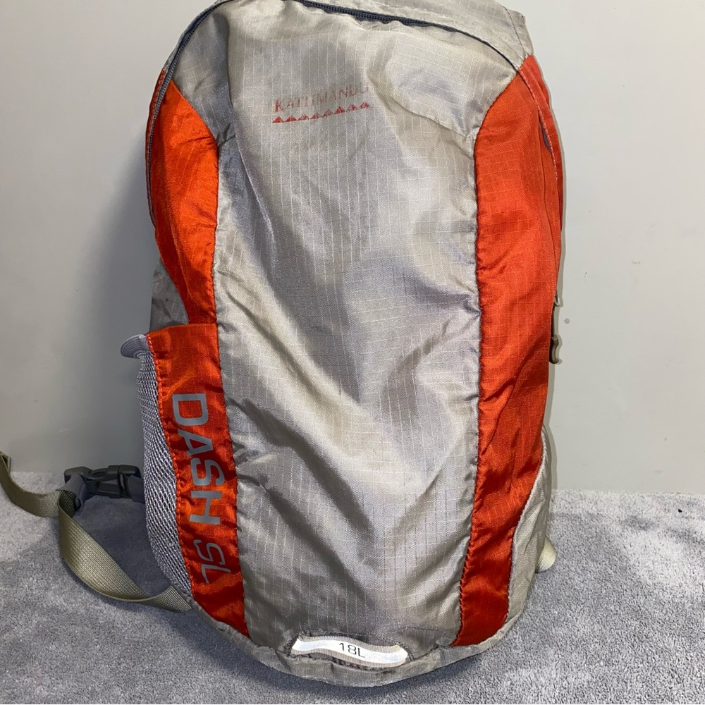 Kathmandu Outdoors Dash SL 18L Backpack Gray and Orange